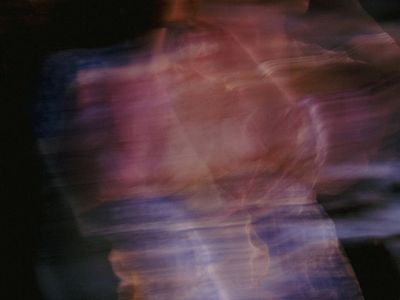 Abstract motion blur of someone performing a cardio movement.